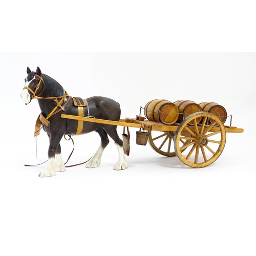 130A - A Beswick Clydesdale harnessed horse model no. 2465 with wooden cart and three barrels. Approx. 22 1... 