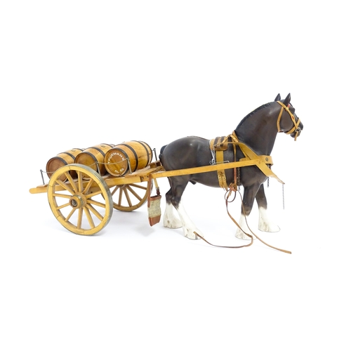 130A - A Beswick Clydesdale harnessed horse model no. 2465 with wooden cart and three barrels. Approx. 22 1... 