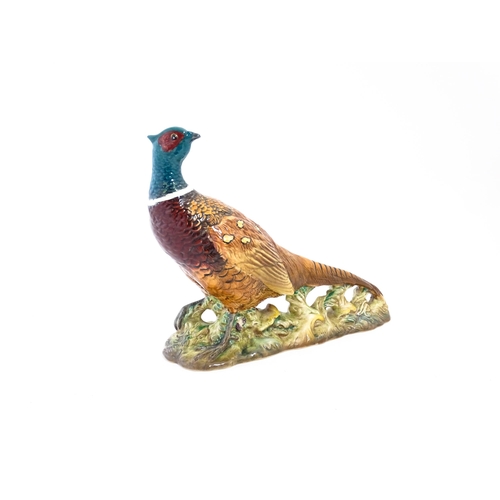 131 - A Beswick model of a pheasant, model no. 1225. Marked under. Approx. 9 3/4