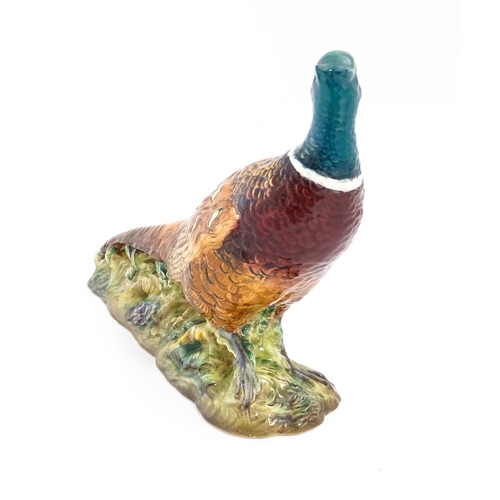 131 - A Beswick model of a pheasant, model no. 1225. Marked under. Approx. 9 3/4