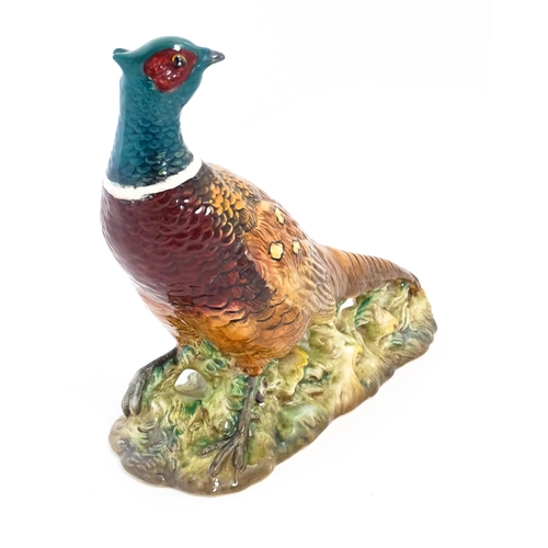 131 - A Beswick model of a pheasant, model no. 1225. Marked under. Approx. 9 3/4