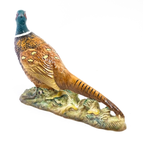 131 - A Beswick model of a pheasant, model no. 1225. Marked under. Approx. 9 3/4