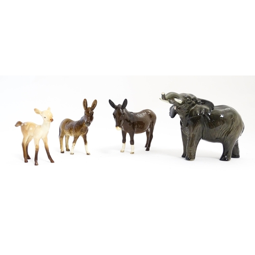 133 - Four Beswick models of animals comprising elephant model no. 974, a fawn no. 1000B, a donkey no. 136... 