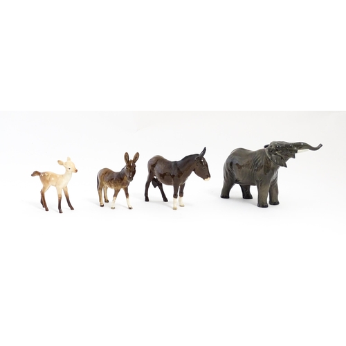 133 - Four Beswick models of animals comprising elephant model no. 974, a fawn no. 1000B, a donkey no. 136... 