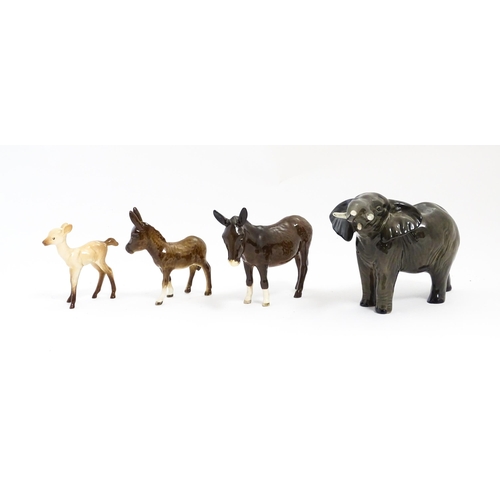 133 - Four Beswick models of animals comprising elephant model no. 974, a fawn no. 1000B, a donkey no. 136... 