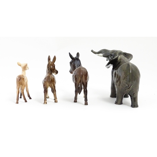 133 - Four Beswick models of animals comprising elephant model no. 974, a fawn no. 1000B, a donkey no. 136... 