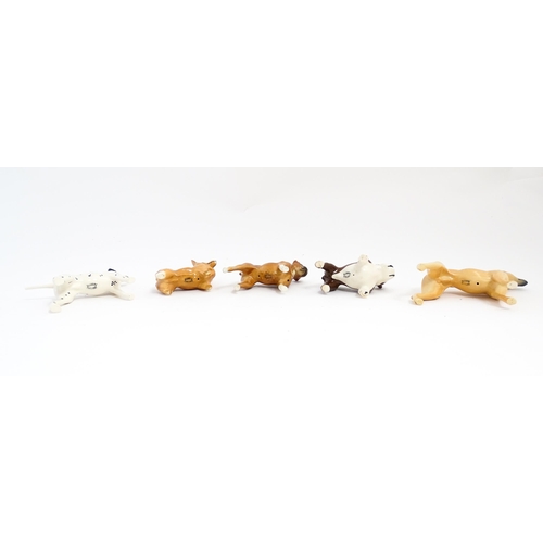 137 - Five Beswick models of dogs comprising Corgi no. 1736, Whippet no. 1786B, Dalmatian no. 961, Bulldog... 