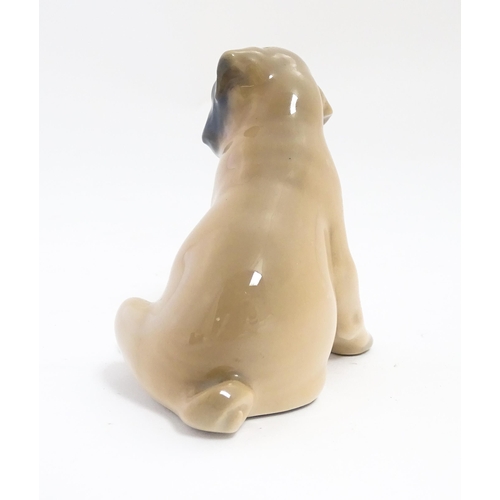 138 - A Royal Copenhagen model of a Pug dog, model no. 3169. Approx. 3 1/4