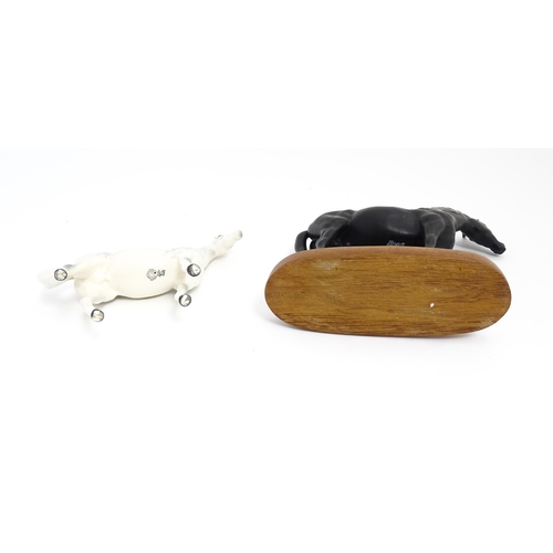 139 - Two Royal Doulton models of horses comprising Black Beauty and a dapple grey horse. Largest approx. ... 