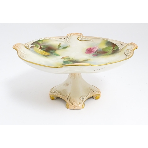 143 - A Royal Worcester blush ivory tazza with rose decoration and gilt highlights. Marked under. Approx. ... 