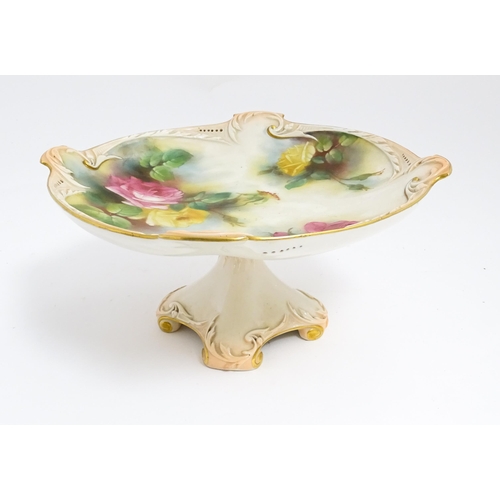 143 - A Royal Worcester blush ivory tazza with rose decoration and gilt highlights. Marked under. Approx. ... 