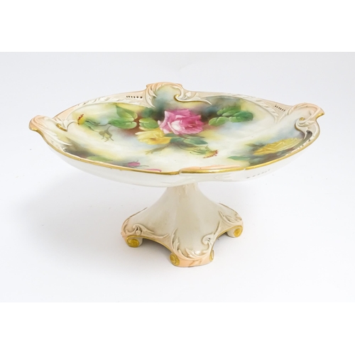 143 - A Royal Worcester blush ivory tazza with rose decoration and gilt highlights. Marked under. Approx. ... 