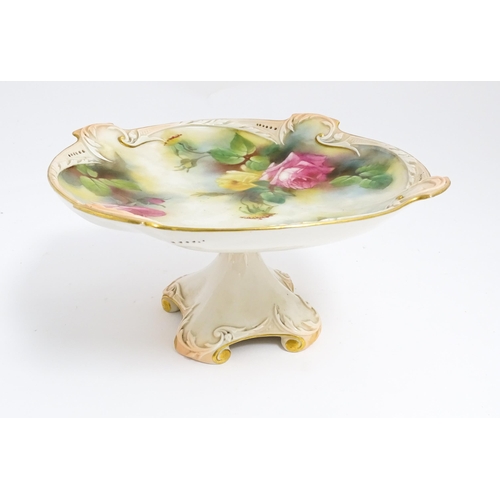 143 - A Royal Worcester blush ivory tazza with rose decoration and gilt highlights. Marked under. Approx. ... 