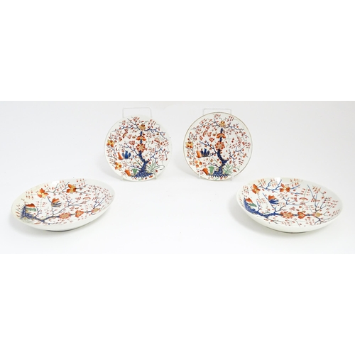 145 - Four Derby plates / dishes decorated in the Formal Lotus Tree pattern in a Japanese Kakiemon style. ... 