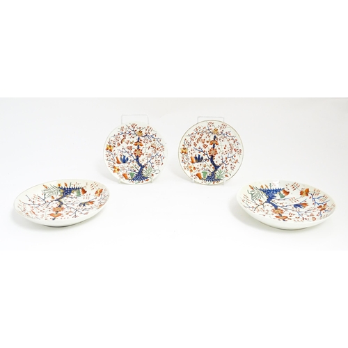 145 - Four Derby plates / dishes decorated in the Formal Lotus Tree pattern in a Japanese Kakiemon style. ... 