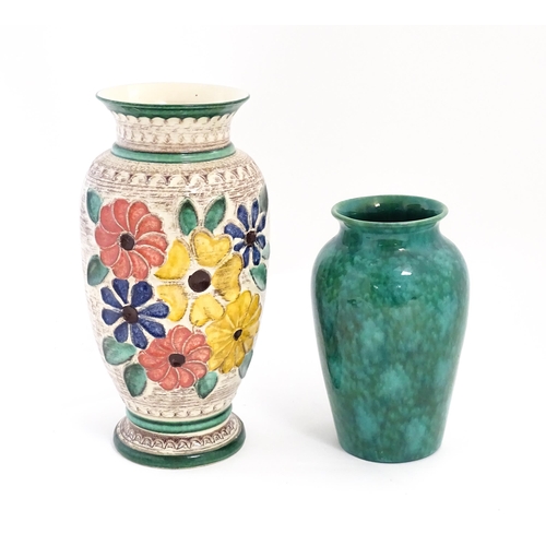 152 - A West German vase decorated with flowers. Marked under. Together with another with a mottled green ... 