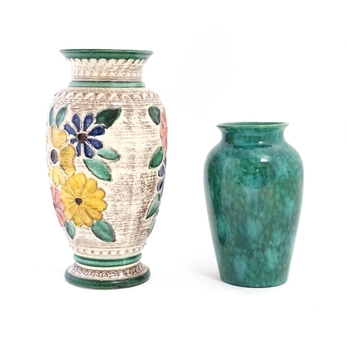 152 - A West German vase decorated with flowers. Marked under. Together with another with a mottled green ... 