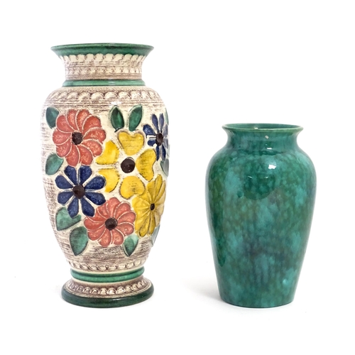 152 - A West German vase decorated with flowers. Marked under. Together with another with a mottled green ... 