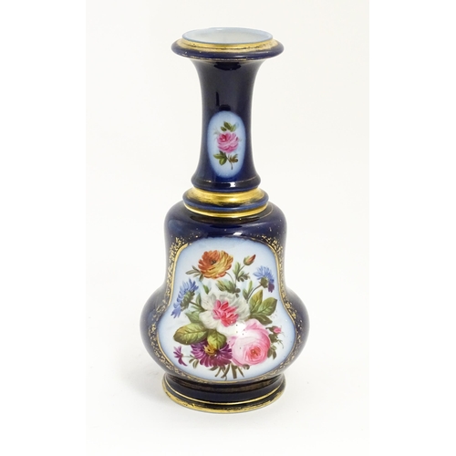 153 - A late 19th / early 20thC vase / lamp base with floral panels decorated with hand painted rose, corn... 