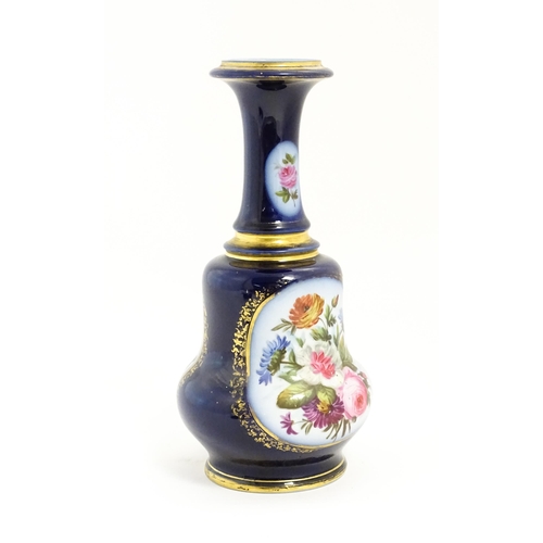 153 - A late 19th / early 20thC vase / lamp base with floral panels decorated with hand painted rose, corn... 