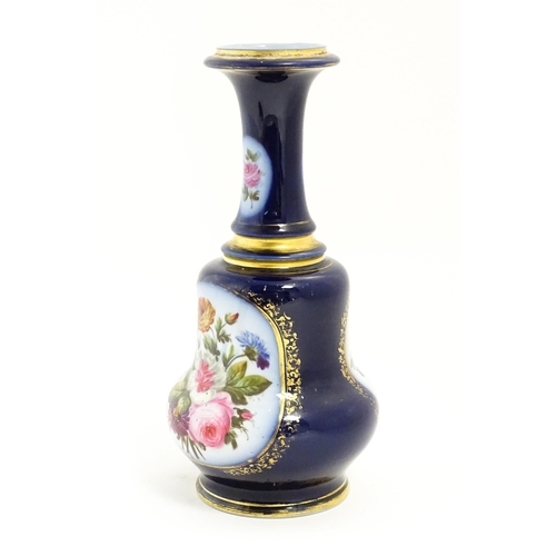 153 - A late 19th / early 20thC vase / lamp base with floral panels decorated with hand painted rose, corn... 