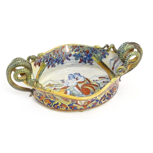 163 - An Italian lustre glazed maiolica bowl / dish with twin snake / serpent handles with hand painted de... 