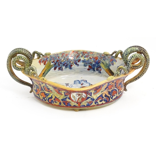 163 - An Italian lustre glazed maiolica bowl / dish with twin snake / serpent handles with hand painted de... 