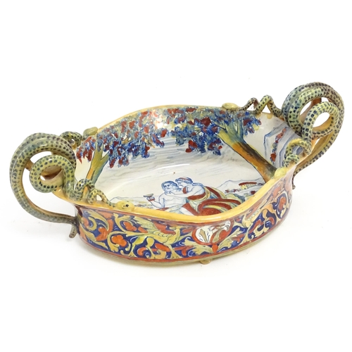 163 - An Italian lustre glazed maiolica bowl / dish with twin snake / serpent handles with hand painted de... 