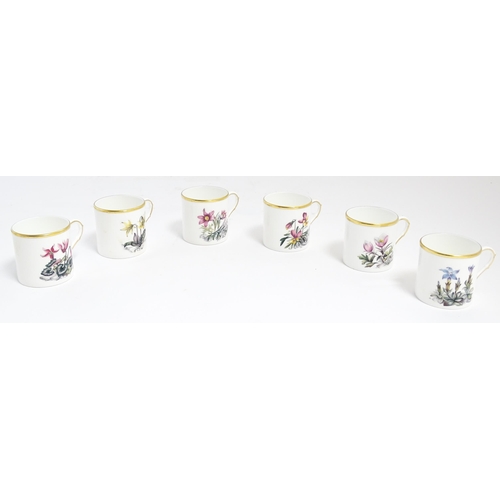 170 - A Royal Worcester coffee set, comprising 6 cups and saucers decorated with botanical decoration and ... 