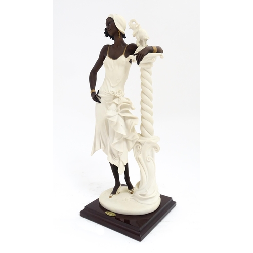 175 - An Italian Florence figure designed by Giuseppe Armani titled 'Mahogany' depicting a lady with a col... 