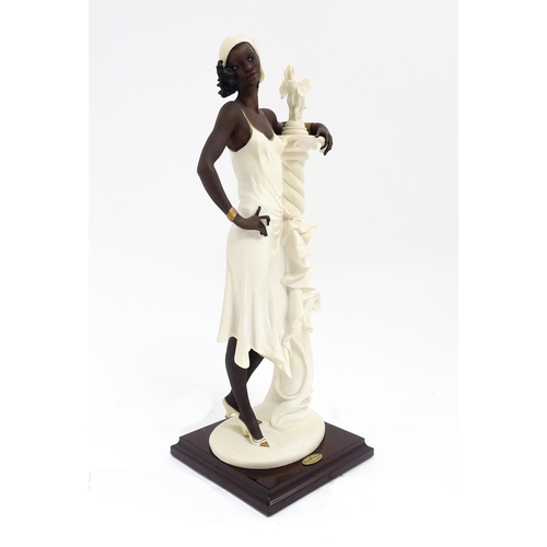 175 - An Italian Florence figure designed by Giuseppe Armani titled 'Mahogany' depicting a lady with a col... 