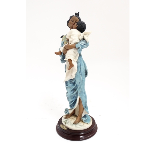 176 - An Italian Florence figure designed by Giuseppe Armani titled Magic Touch, depicting a mother and ch... 