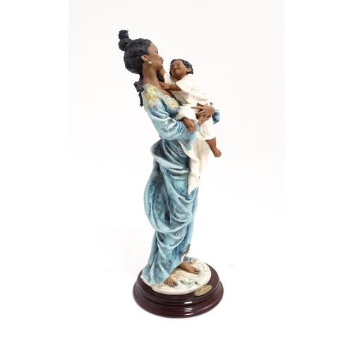 176 - An Italian Florence figure designed by Giuseppe Armani titled Magic Touch, depicting a mother and ch... 