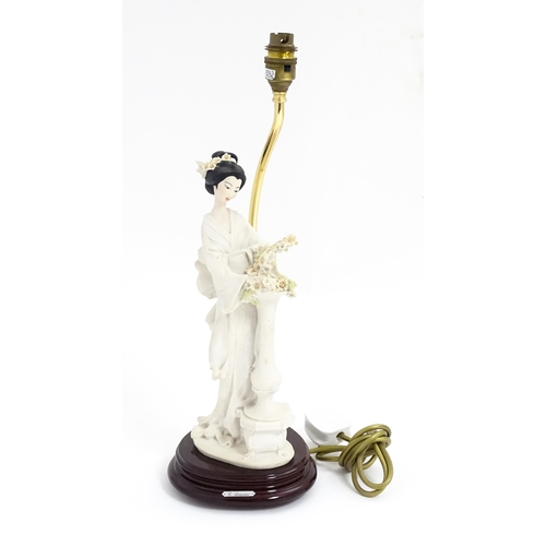 179 - An Italian Florence figural table lamp designed by Giuseppe Armani modelled as a Geisha girl with fl... 