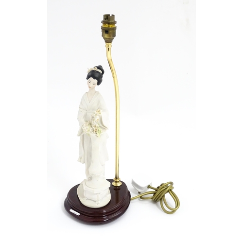 179 - An Italian Florence figural table lamp designed by Giuseppe Armani modelled as a Geisha girl with fl... 