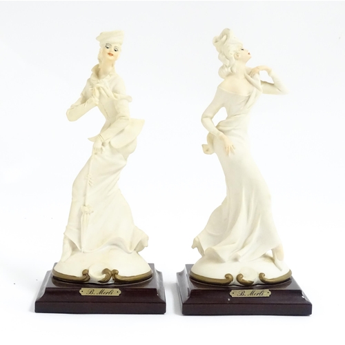 180 - A pair of Italian figural modelled as ladies, designed by B. Merli. Approx. 8 3/4