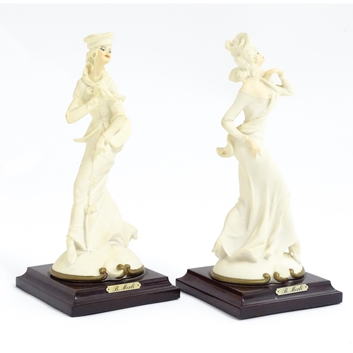 180 - A pair of Italian figural modelled as ladies, designed by B. Merli. Approx. 8 3/4