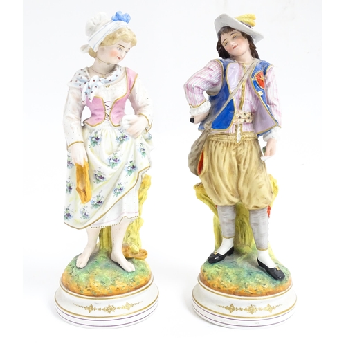 181 - A pair of Continental figures modelled as a young man and woman. Approx. 12 1/2