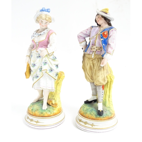 181 - A pair of Continental figures modelled as a young man and woman. Approx. 12 1/2