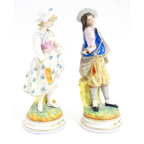 181 - A pair of Continental figures modelled as a young man and woman. Approx. 12 1/2