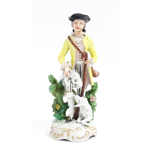 182 - A Continental figure modelled as a shepherd boy with bocage, crook and lambs. Approx. 9 3/4