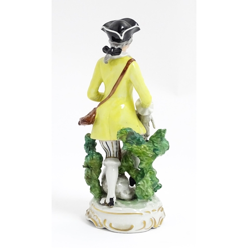 182 - A Continental figure modelled as a shepherd boy with bocage, crook and lambs. Approx. 9 3/4