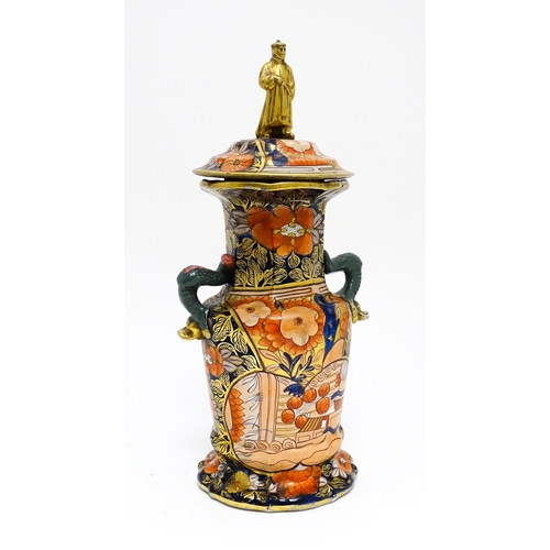 50 - A 19thC Masons Ironstone vase with twin handles of dolphin / serpent form, decorated in the Imari pa... 