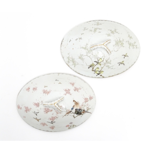 62 - A pair of Japanese tureens / lidded serving dishes with hand painted decorating various flowers and ... 