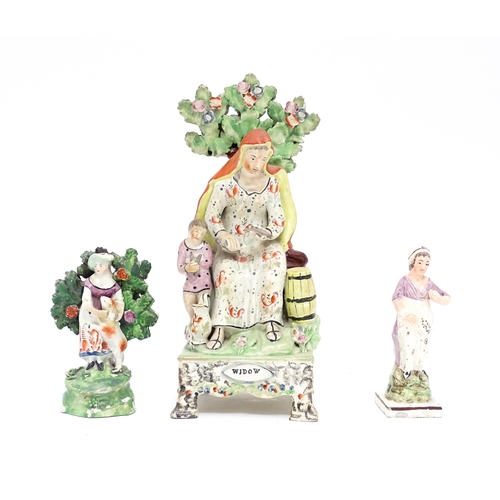 64 - A 19thC Staffordshire pottery figure group The Widow. Together with a Staffordshire bocage figure gr... 