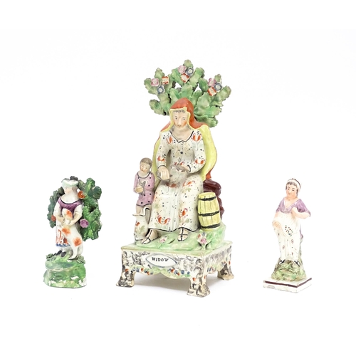 64 - A 19thC Staffordshire pottery figure group The Widow. Together with a Staffordshire bocage figure gr... 