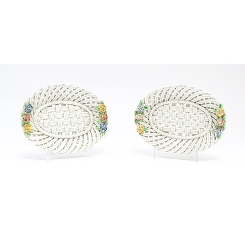 66 - A pair of 19thC cream dishes of basket weave form with applied floral and foliate detail. Approx. 10... 