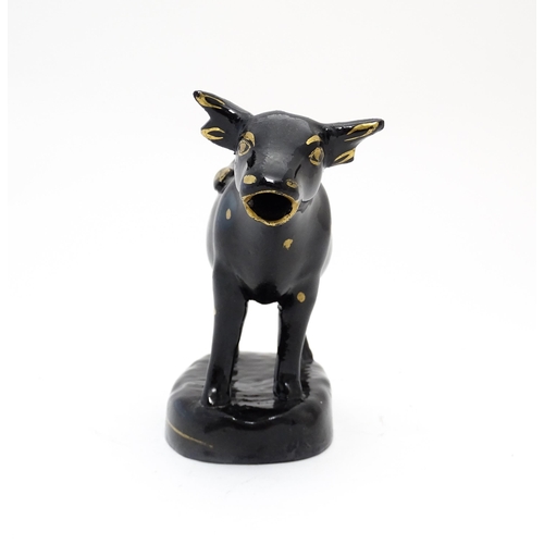 71 - A Staffordshire style black cow creamer with gilt spot detail. Approx. 5 1/4