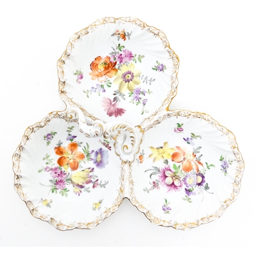 83 - A Dresden three sectional dish with hand painted floral sprays and gilt highlights. Marked under. Ap... 