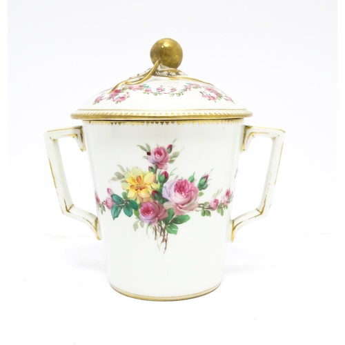 84 - A Sevres twin handled pot and cover decorated with floral garlands and bow detail, with gilt monogra... 